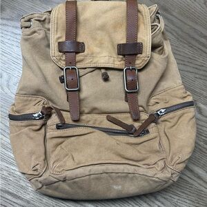 Vintage Tan and Brown Canvas Backpack with Utilitarian Design